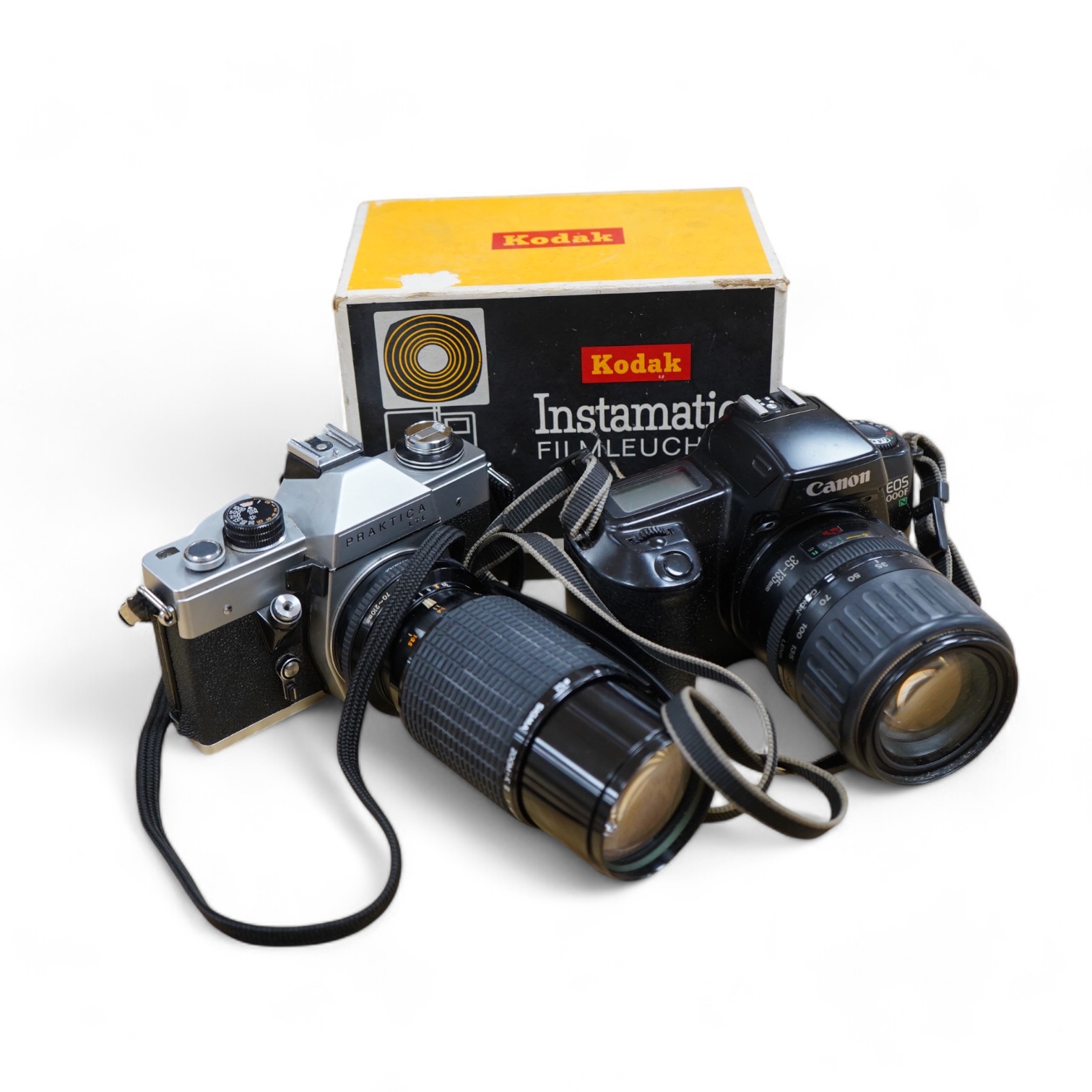 A quantity of cameras and lenses to include a Praktica LTL, Olympus OM77AF, Canon 1000F and Tamron 70-150 lens. Condition - varies